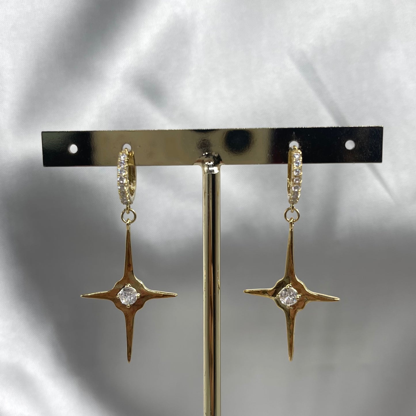 Aretes estrella cruz