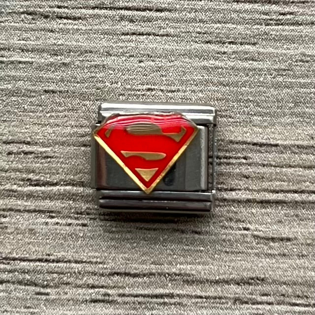 CHARM Logo de Superman