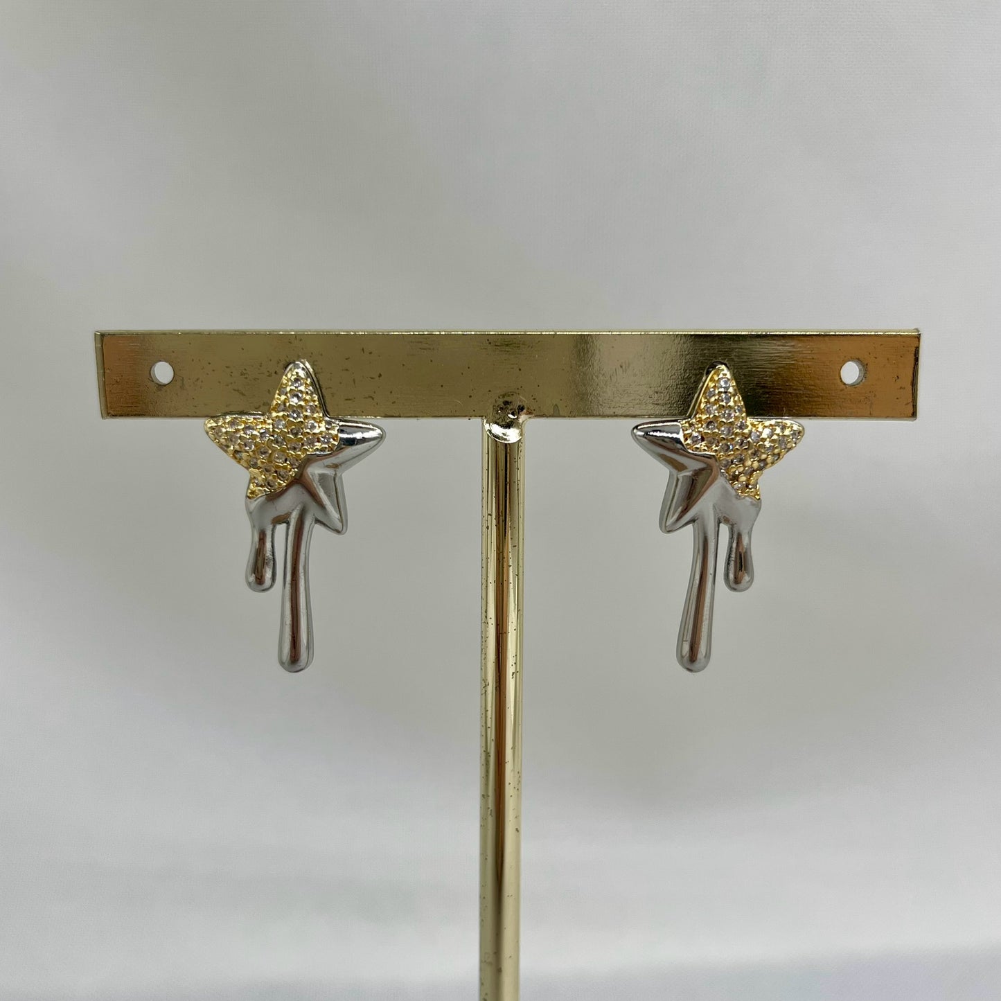 Aretes estrella chorreada plateada