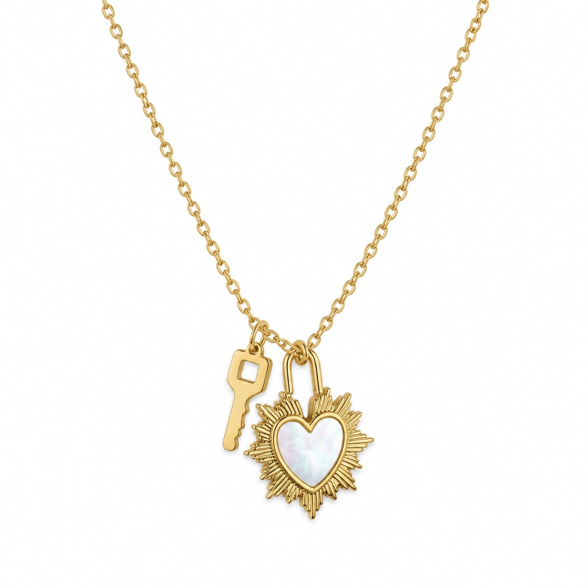 Dije corazón concha y llave