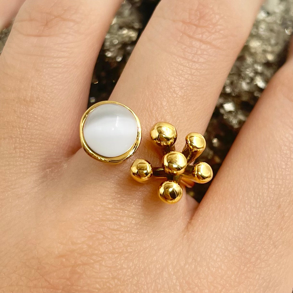 Anillo flor y ojo de gato